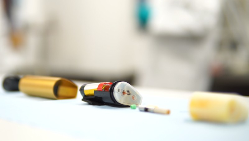 a vape in pieces laid on a table