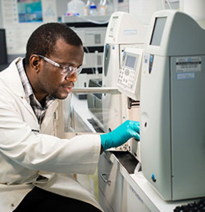 Image of lab scientist performing test