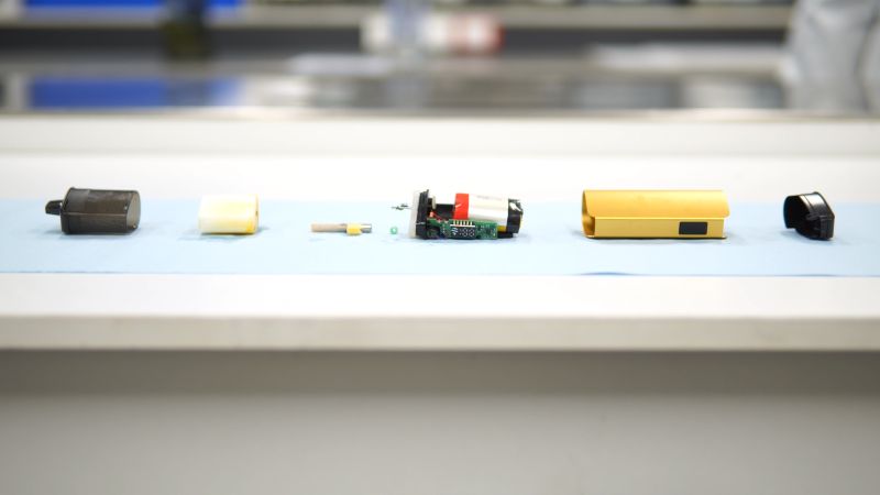 a vape in pieces laid on a table